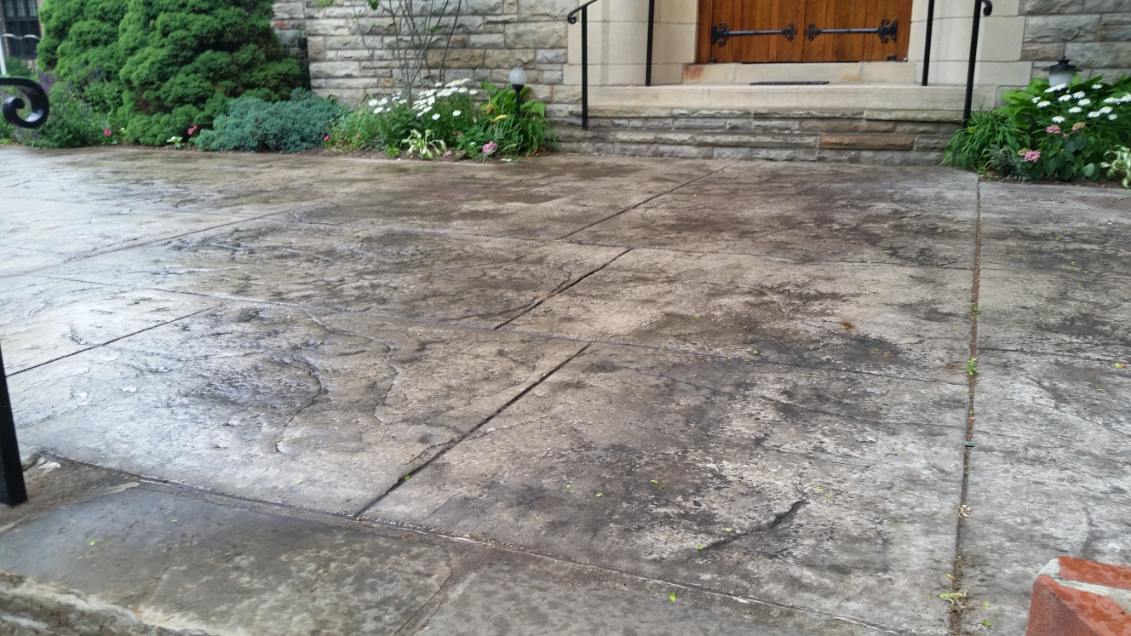 Seamless stone stamped concrete entryway in front of a stone building near Gibsonia, PA