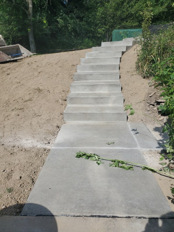 Finished hillside concrete steps with broom-finish walkway in the North Hills, PA