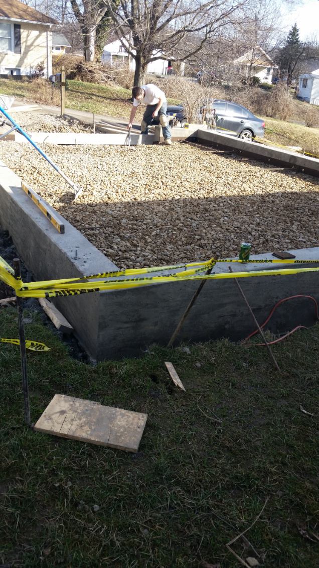 Poured concrete foundation walls with gravel base for a new garage in the North Hills, PA