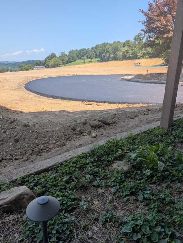 Driveway base prepared and shaped before a concrete pour in the North Hills, PA