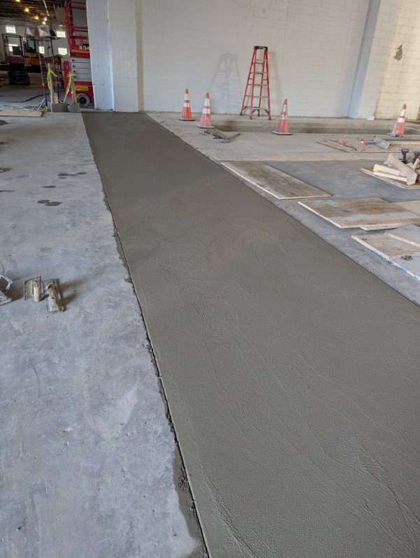 Freshly poured interior concrete slab inside a commercial building in Allegheny County, PA